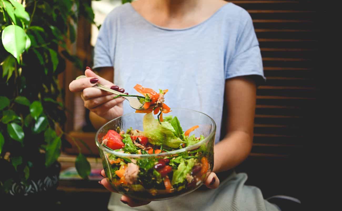 Fresh vegetable and fruit salad in a glass bowl, healthy eating, dietary choice, nutritious meal.