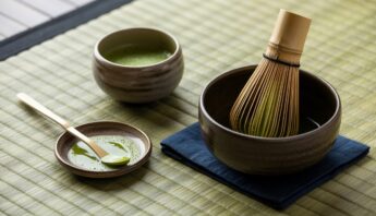 Matcha tea preparation with traditional tools for a healthy lifestyle.