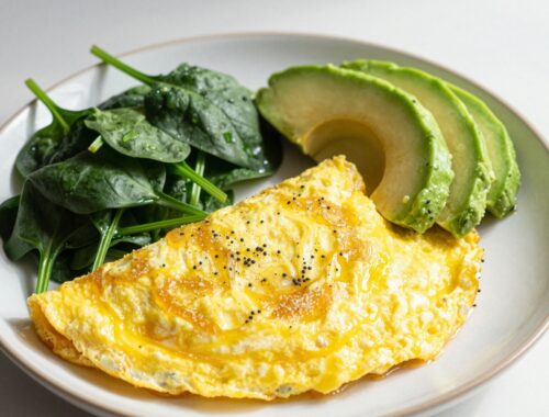 Omelette with spinach and avocado slices