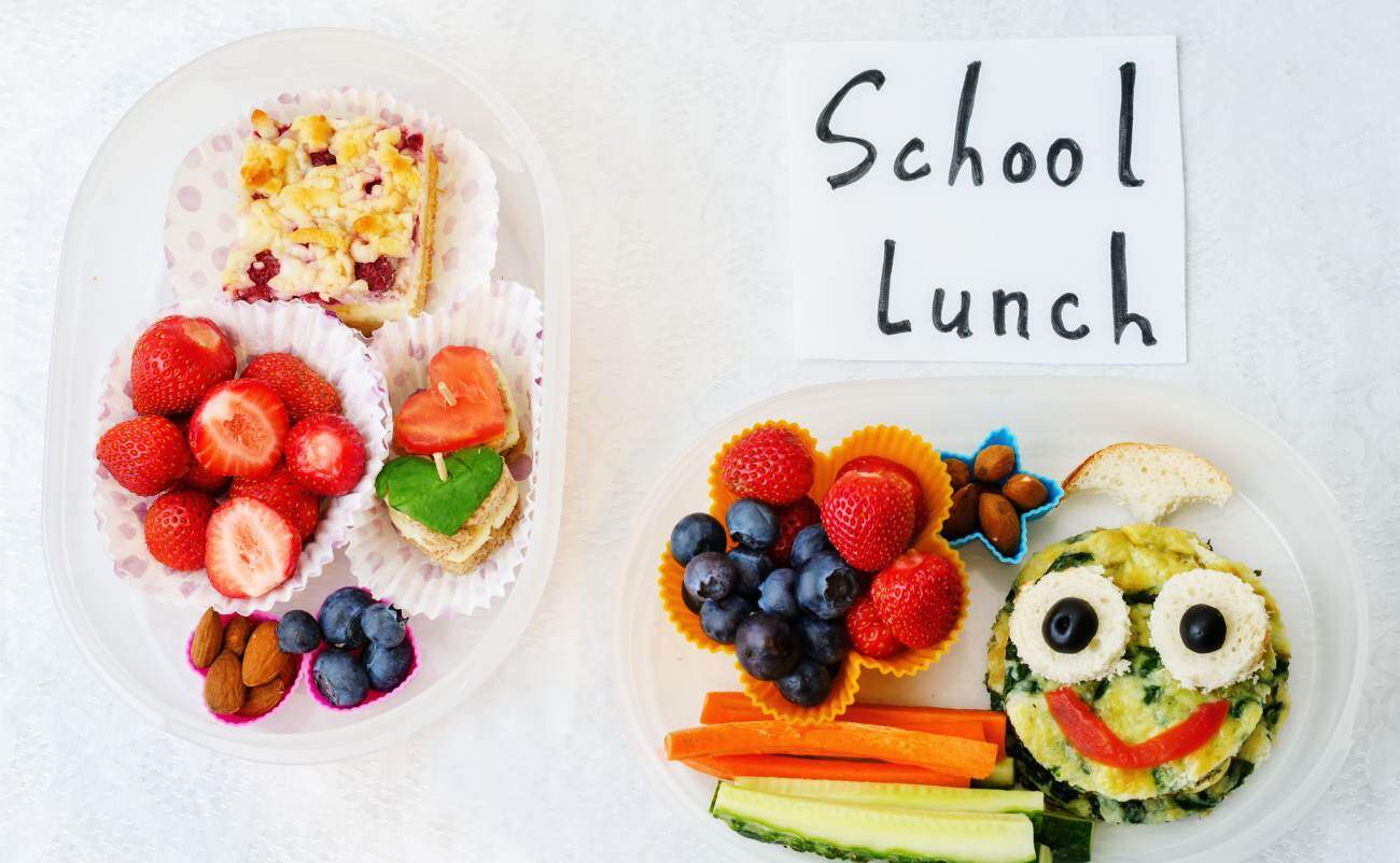 Fresh school lunch with colorful fruits, vegetables, and fun food shapes, promoting healthy eating habits for kids. Perfect for parents looking for nutritious meal ideas for children.