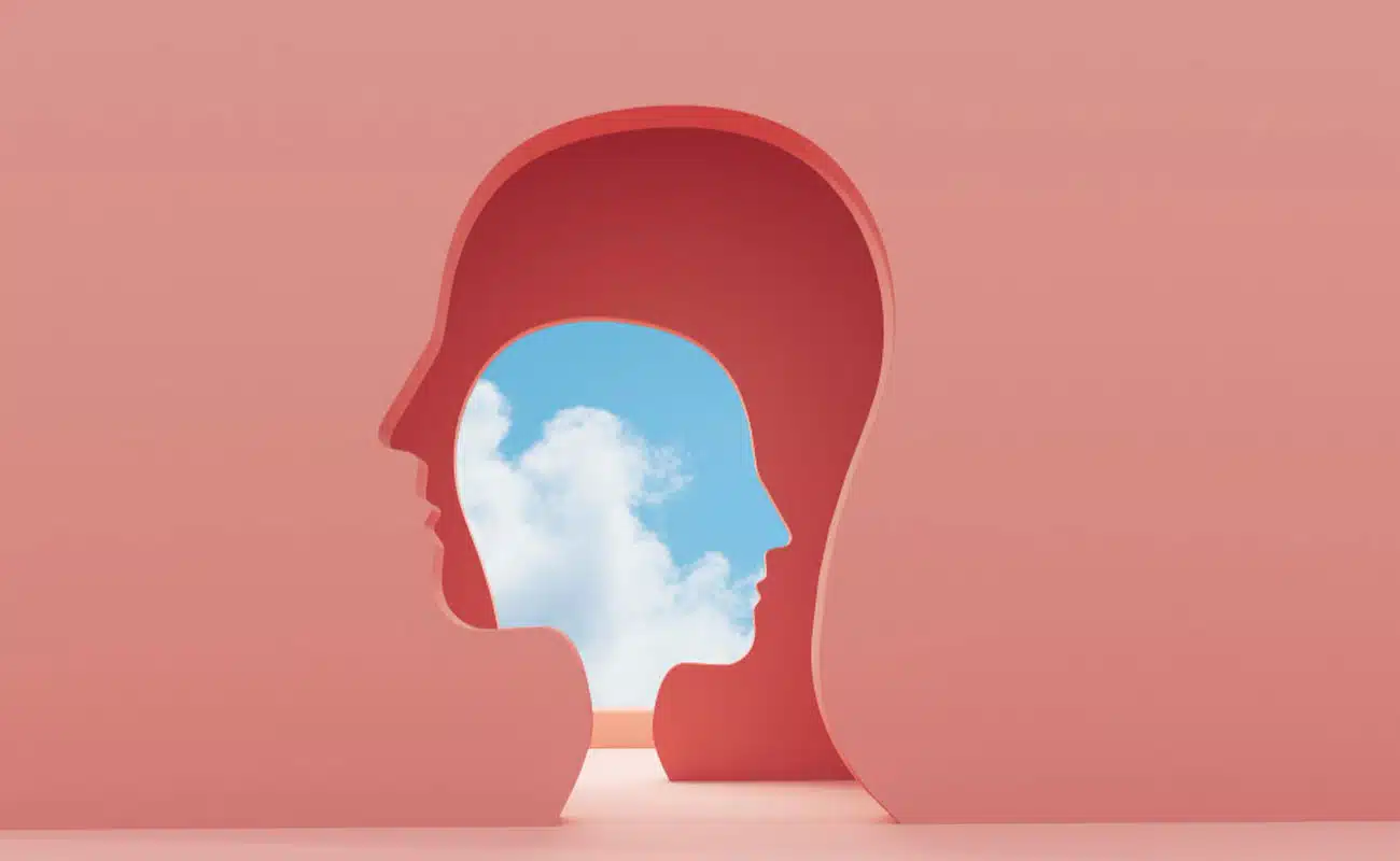Mindfulness and mental wellness illustration featuring a human profile with a cloud-filled sky inside representing mental clarity and peace.