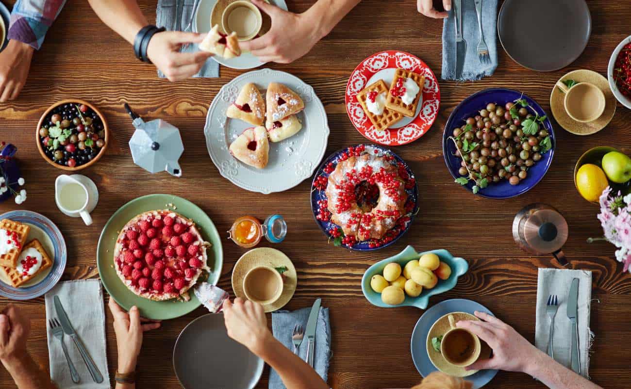 Sugar-free fruit desserts and healthy snacks on a colorful dining table for a nutritious lifestyle.