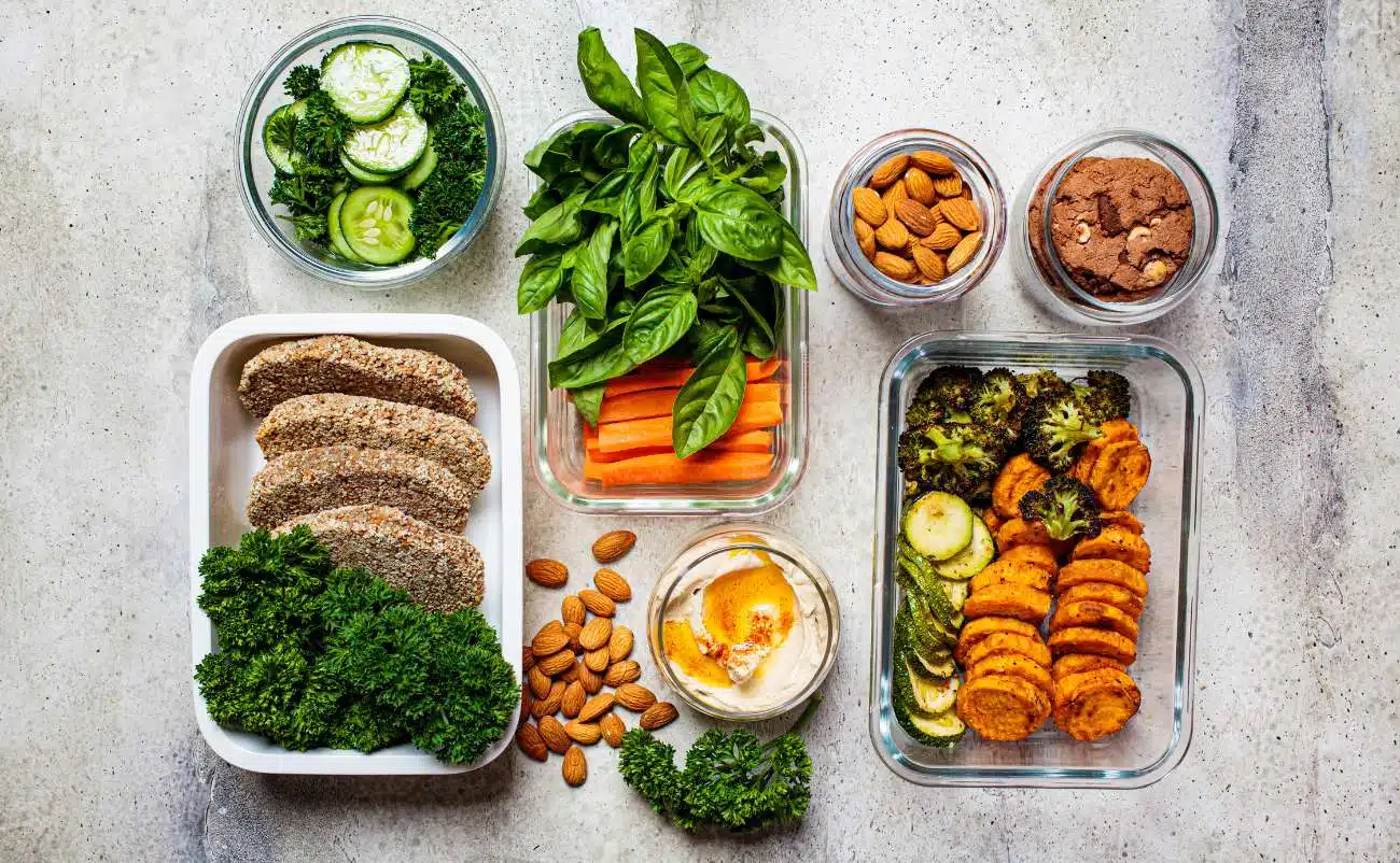 Healthy meal prep with fresh vegetables, lean proteins, nuts, and herbs for balanced nutrition and nutritious eating.