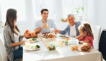 Fresh family enjoying a healthy meal together at the dining table, emphasizing nutritious food choices and family bonding.