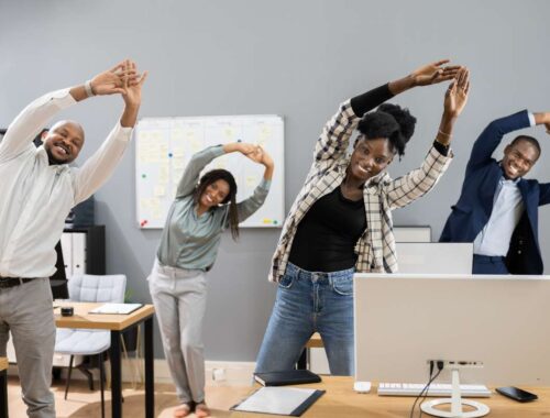 Deeply engage in stretching exercises during office break to promote health and reduce stress, demonstrating a healthy work environment and lifestyle.