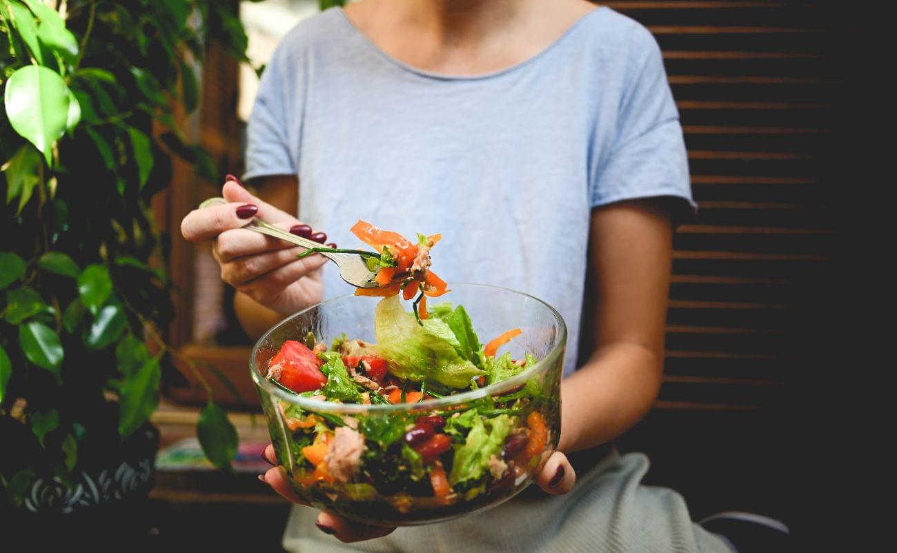 Fresh vegetable and fruit salad in a glass bowl, healthy eating, dietary choice, nutritious meal.