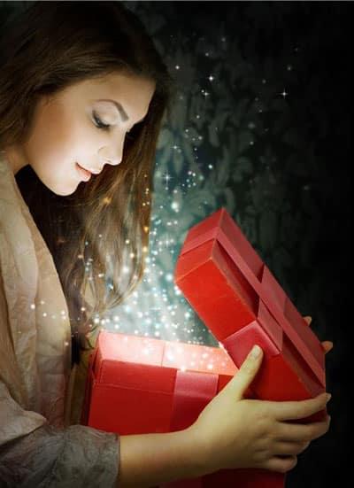 Festival season Girl happy excited to open gift surprised