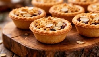 Bakery Style Frangipane Mince Pies With Almond Crunch 8 Delicious mini almond tartlets topped with sliced almonds and a crumbly crust, perfect for dessert or special occasions.