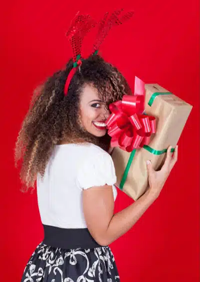 Christmas eve festival season girl happy to get surprised gift