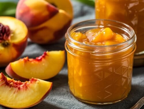 Sweet peach jam with fresh peaches and a rustic background, promoting healthy eating and homemade preserves.