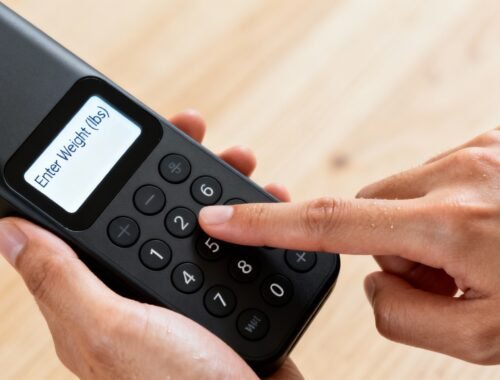 Enter weight on digital scale for health and fitness tracking.