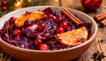 Vibrant red cranberry salad with blood orange slices and cinnamon sticks, perfect for holiday nutrition and seasonal celebration.