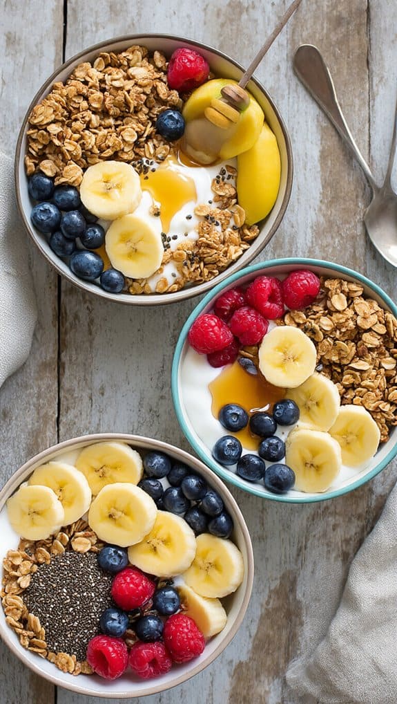 Fresh fruit and granola yogurt bowls with bananas, blueberries, raspberries, and chia seeds, perfect for healthy breakfast or snack options.