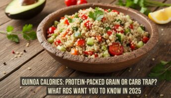 Rich quinoa salad with fresh cherry tomatoes, cucumbers, and herbs in a wooden bowl. Perfect for healthy eating and meal prep. Great source of protein and fiber.